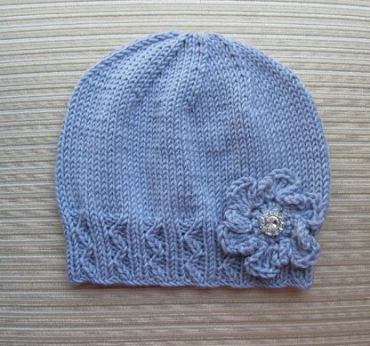Lilac Hat with Zig Zag Ribbing and a Crochet Flower for a Lady