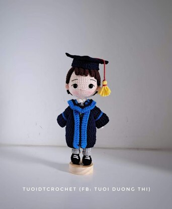 Graduation boy doll