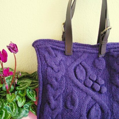 Purple bag with bobbles and cables