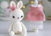 Little bunny toy in light pink dress with the flower on the ear