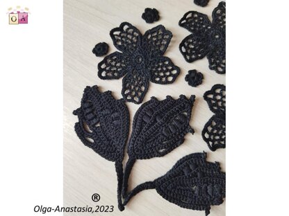 Crochet composition of flowers and leaves in black