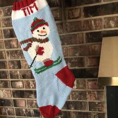 Snowman stocking on skis