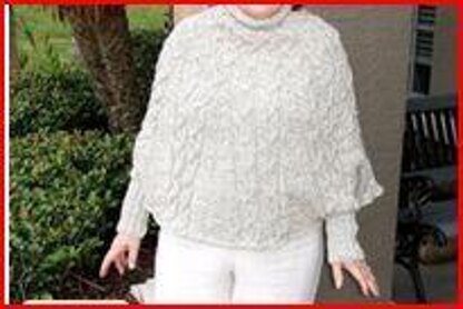 Cabled poncho with cuffs