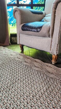 Wide rug with double braid