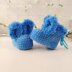 A warm crochet pattern set for newborns: bunny ear booties, a hat with long bunny ears, bunny rattle, crochet pattern kit for photo shoots