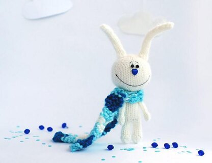 White rabbit in a blue striped scarf