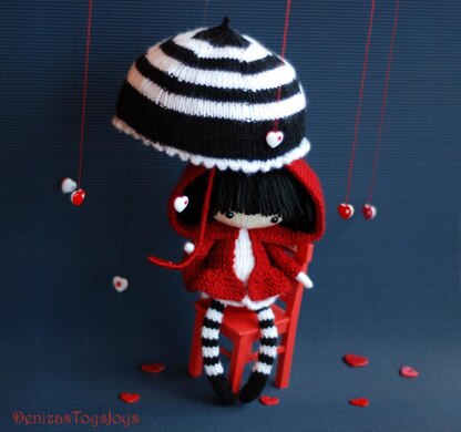 Eugene. The Doll in striped stockings with big umbrella.