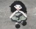 Crochet doll in olive green dress