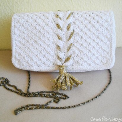 White knit clutch with gold tassel