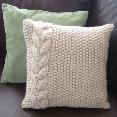 Braided cable and moss stitch pillow cover