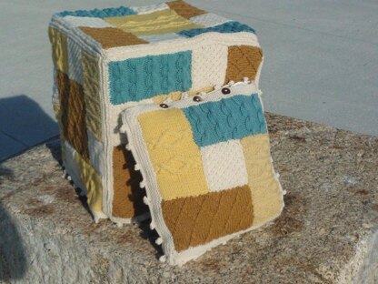 Knitted patchwork cushion, footstool, draught excluder, rug, living room collection