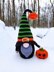 Halloween black gnome with pumpkin