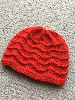 Baby hat with feather and fan pattern