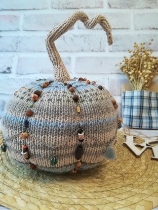 Pumpkin with knitting needles in BOHO style for home decor