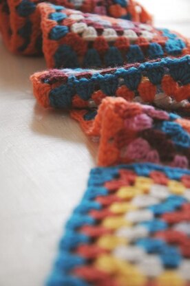 Pretty Pocketed crochet scarf in bright colors