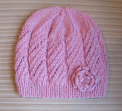 Pink Hat with Eyelet Panels and a Knit Rose for a Lady