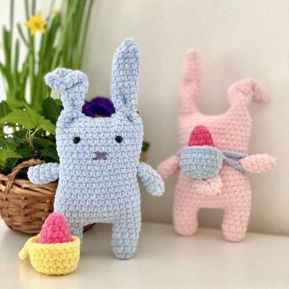 Bunnies with backpack and easter eggs