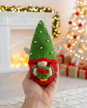 Сhristmas gnome Elf with a gift