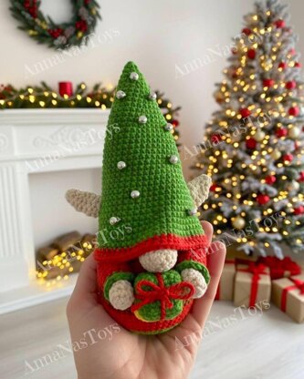 Сhristmas gnome Elf with a gift