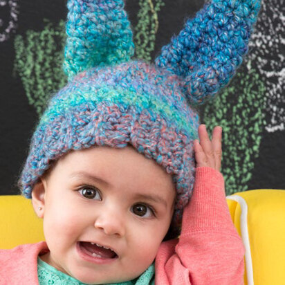 Free Crochet Star Baby Earflap Hat pattern using Bernat Bundle Up