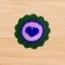 Crochet round coaster with heart