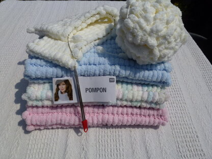 Pompon yarn baby blanket for moses basket, pram or car seat