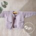 Child’s Cardigan with cable detail on sleeves and pockets - P065