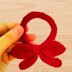 A crochet scrunchie bow