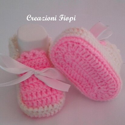 Pink and white baby shoes