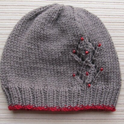 Seamless Hat with Lacy Diamonds and Red Beads in size Adult - knitting pattern