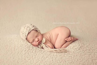 #27 Newborn cabled bonnet