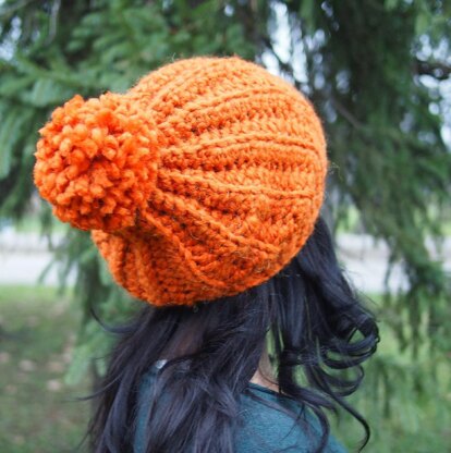 Knit look bulky hat with pom pom