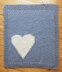 Chunky intarsia heart motif crib/pram blanket