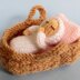 Tiny Baby Doll in a Basket Crib