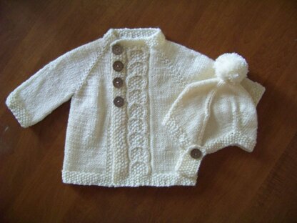 Baby cardigan with offset cable front