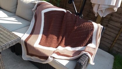 Crochet throw in shades of cream and brown