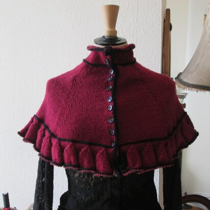 Victorian-style ruffled cape