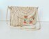 Clutch with raffia yarn