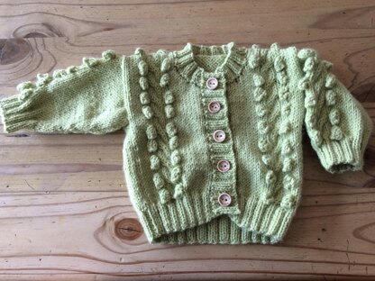 Baby’s cardigan with bobble detail
