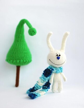 White rabbit in a blue striped scarf