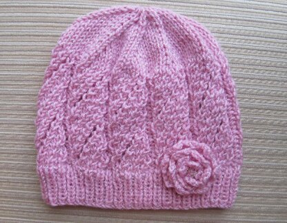 Pink Hat with Eyelet Panels and a Knit Rose for a Lady