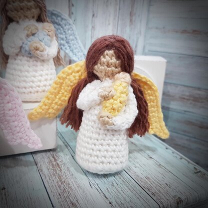 Miniature Angel holding baby