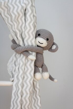 Monkey curtain tie back