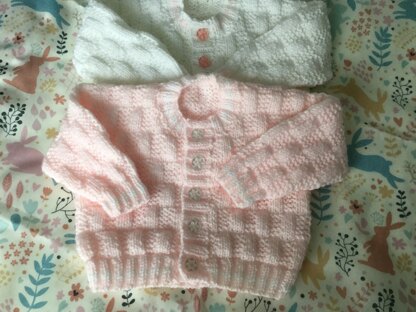 Pink and white cardigans