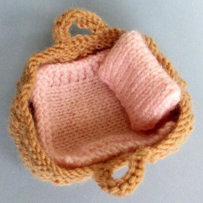 Tiny Baby Doll in a Basket Crib