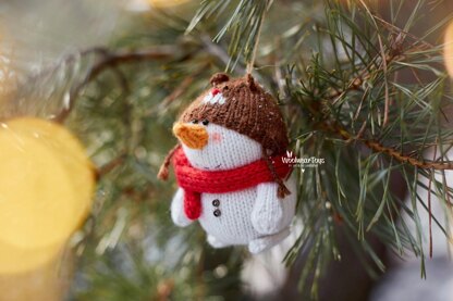 Knitted snowman in Teddy bear hat.