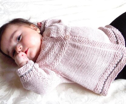 Baby jacket with round yoke and moss stitch trim - P033