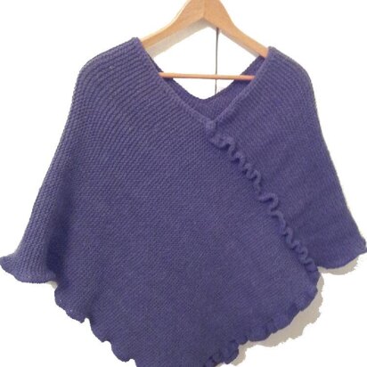 Knitted adult poncho with crochet trim