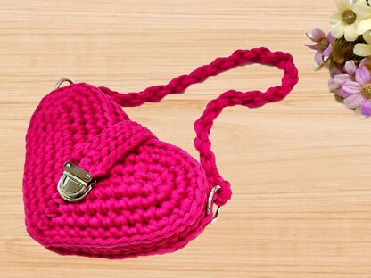 A crochet pink heart bag