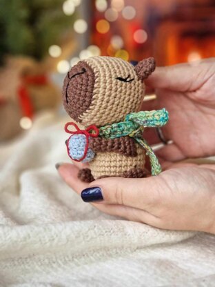 Cute capybara toy with a gift